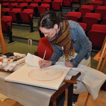 14 selected artists paint an icon during the Symposium