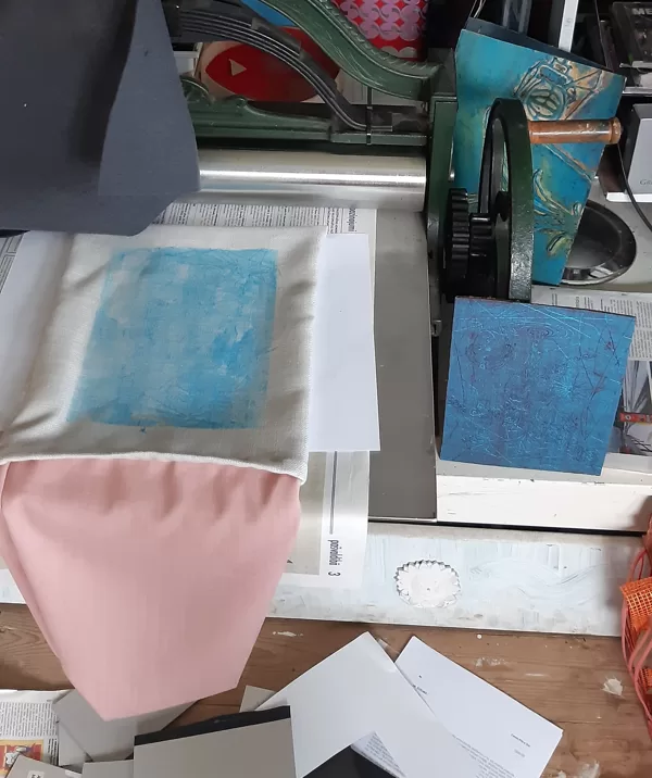 I printed a base color with my large graphic press with linocut.